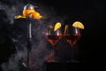 Pair of glasses with alcoholic drink beverage wine and hookah with fruits Royalty Free Stock Photo