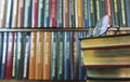 A Pair of Glasses on a Stack of Books