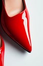 Glossy red high heels on white background showcasing sleek design and elegant style Royalty Free Stock Photo