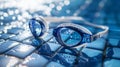 A pair of goggles is sitting on a blue tile Royalty Free Stock Photo