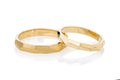 Pair of gold geometric wedding rings isolated on white background Royalty Free Stock Photo