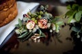 A pair of gold rings for the newlyweds and a boutonniere Royalty Free Stock Photo