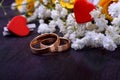 Pair of gold wedding rings and a bouquet of roses Royalty Free Stock Photo