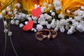 Pair of gold wedding rings and a bouquet of roses Royalty Free Stock Photo