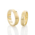 Pair of gold wedding rings isolated on white background Royalty Free Stock Photo