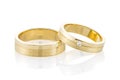 Pair of gold wedding rings isolated on white background Royalty Free Stock Photo