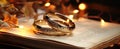 A pair of gold wedding rings on a prayer book Royalty Free Stock Photo