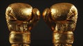 Pair of golden boxing gloves reflecting light against dark background. Concept of victory and success in sports