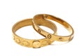 A pair of golden bracelets with different widths and design Royalty Free Stock Photo