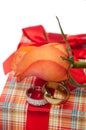 Pair of golden rings with orange rose on the red gift box with r Royalty Free Stock Photo