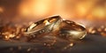 A pair of gold wedding rings with diamonds. Bokeh background