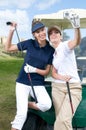 Pair of golf players in the course of a match Royalty Free Stock Photo