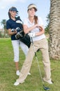 Pair of golf players in the course of a match Royalty Free Stock Photo