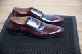 A pair of good beautiful and expensive men`s shoes. The concept of success and style. Maroon.