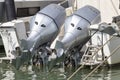 Pair gray marine engines outboard model Honda 250 mounted on a white fiberglass pleasure boat