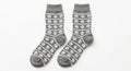 Pair of Gray Socks with White Flower Pattern on White Background clothing apparel Royalty Free Stock Photo