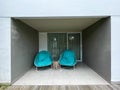 A pair of green lounge chairs in front of the room Royalty Free Stock Photo