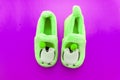 Pair of green textile slippers isolated over white Royalty Free Stock Photo