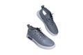 Pair of grey sneakers isolated on white background with clipping path. Royalty Free Stock Photo
