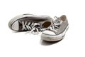 A pair of grey sneakers on white Royalty Free Stock Photo