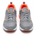 A pair of grey sneakers with white soles, isolated on a white Royalty Free Stock Photo