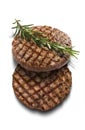 Pair of grilled beef burgers with rosemary
