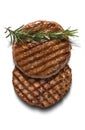 Pair of grilled beef burgers with rosemary