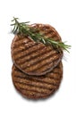 Pair of grilled beef burgers with rosemary