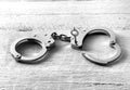 Pair of handcuffs with one side unlocked