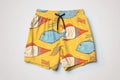 a pair of handmade designer swim trunks on simple background