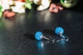 A pair of handmade earrings from beads of turquoise color Royalty Free Stock Photo