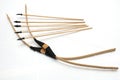 A pair of handmade wooden short bows with some arrows Royalty Free Stock Photo