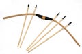 A pair of handmade wooden short bows with some arrows