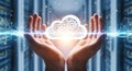 Hands holding glowing cloud icon representing cloud computing and data storage Royalty Free Stock Photo