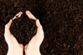 A pair of hands cupping dark rich peat soil and bark pieces Royalty Free Stock Photo