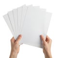 A pair of hands holding a stack of blank white paper sheets Royalty Free Stock Photo