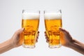 A Pair Of Hands Holding Two Glasses Of Beer Royalty Free Stock Photo