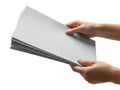 A pair of hands offering a stack of white paper sheets Royalty Free Stock Photo