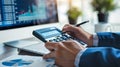 A pair of hands operates a calculator next to eyeglasses and financial documents on a desk..AI generated image Royalty Free Stock Photo