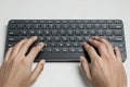 Hands typing on a modern keyboard Royalty Free Stock Photo