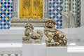 Chinese guardian lions at the entrance of one of the buildings within the Grand Palace in Bangkok, Thailand