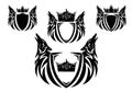 Pair of howling wolf heads with heraldic shield and royal king crown black and white vector heraldic design set Royalty Free Stock Photo