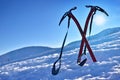 Pair of ice axes on mountain slope