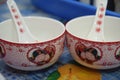 A pair of identical ceramic bowls and spoons for Asian Chinese custom wedding day glutinous riceballs soup