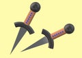 A pair of identical daggers with pointed blade and round pommel against a light yellow backdrop Royalty Free Stock Photo