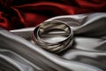 Intertwined silver rings on a bed of silk, symbolizing the unity and connection of love on Valentine\'s Day. AI Generated