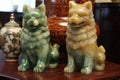 pair of jade fu dogs guarding antique vase