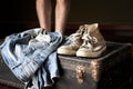 Pair of jeans and sneakers on suitcase Royalty Free Stock Photo