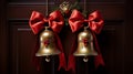 A pair of jingle bells hanging from a doorknob