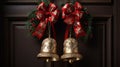 A pair of jingle bells hanging from a doorknob